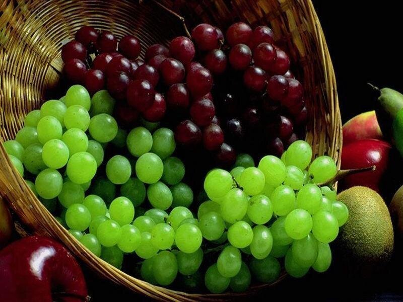 basket of fresh grapes and fruit