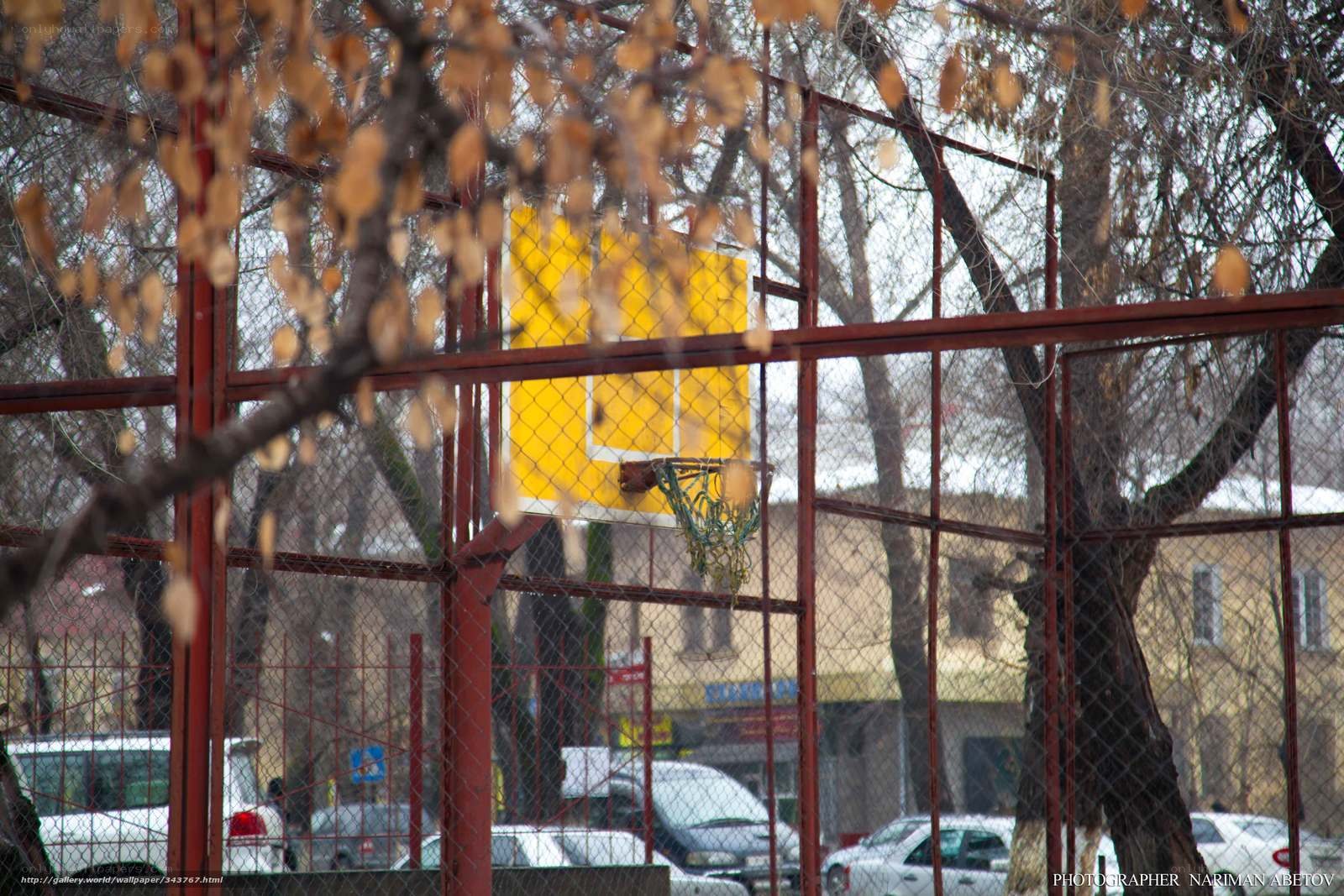 basketball court behind fence