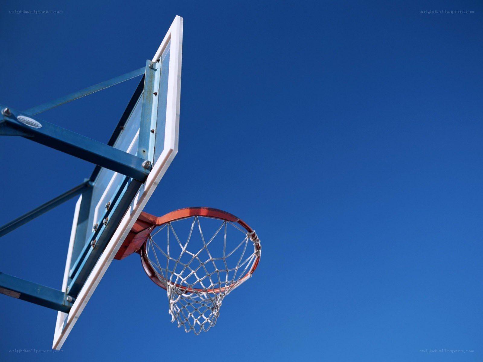 basketball hoop against blue sky
