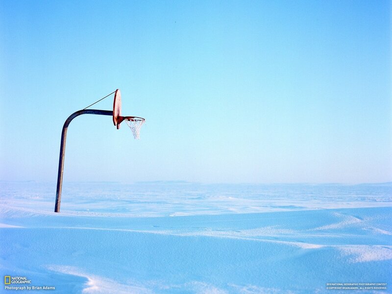 Basketball hoop in snowy landscape
