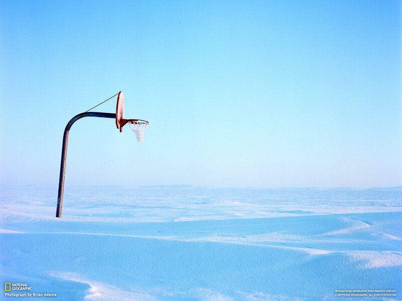 Basketball hoop in snowy landscape