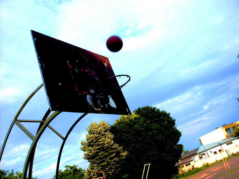 basketball hoop with ball in air