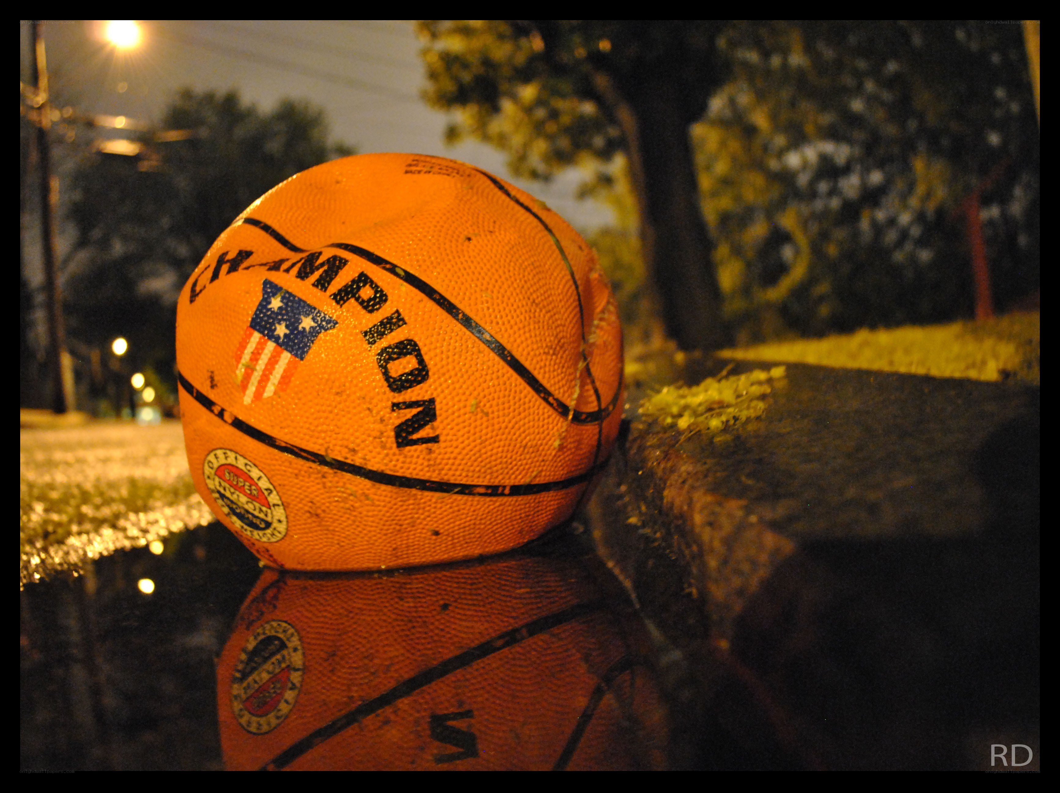 Basketball on a curb at night