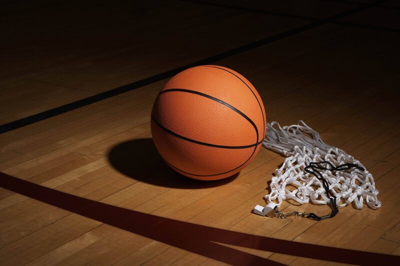 Basketball on court with net