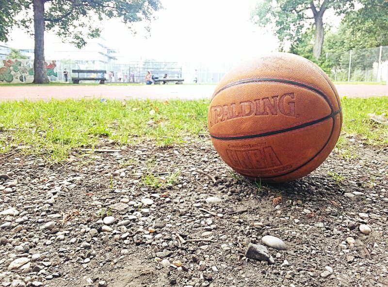 Basketball on gravel ground