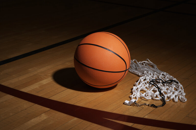Basketball on gym floor