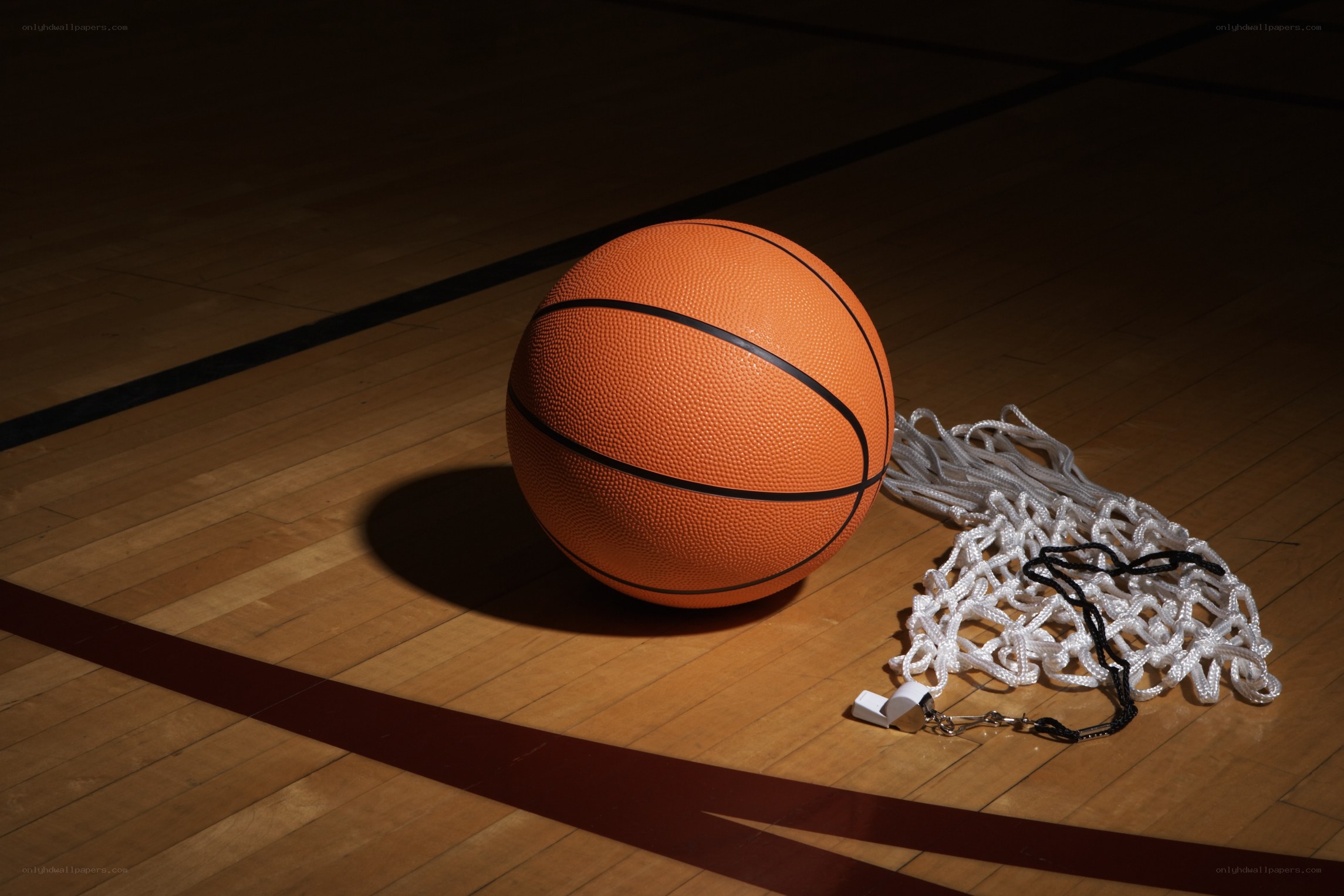 Basketball on gym floor