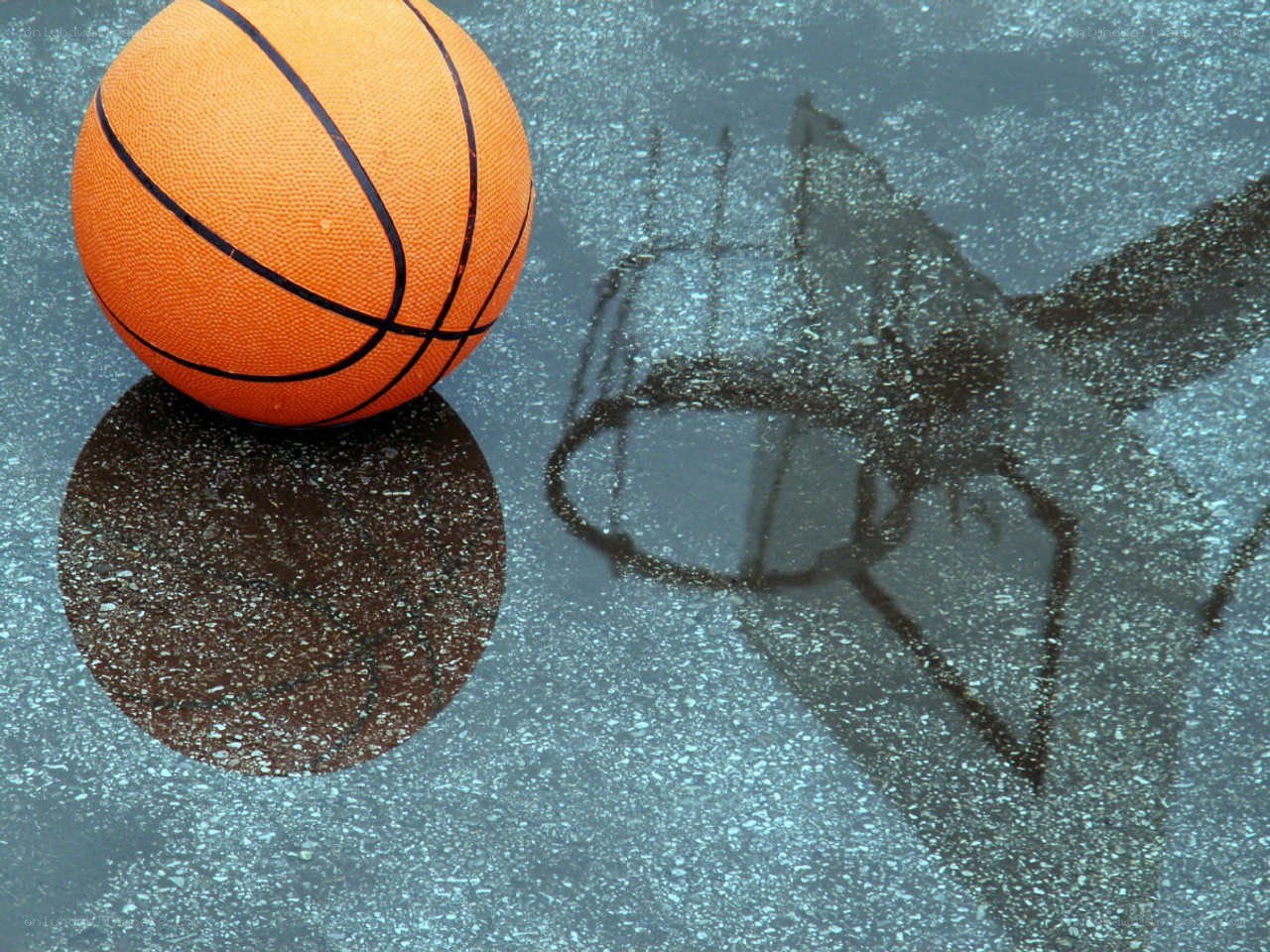 Basketball on wet pavement