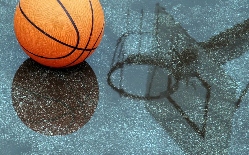 Basketball on wet pavement