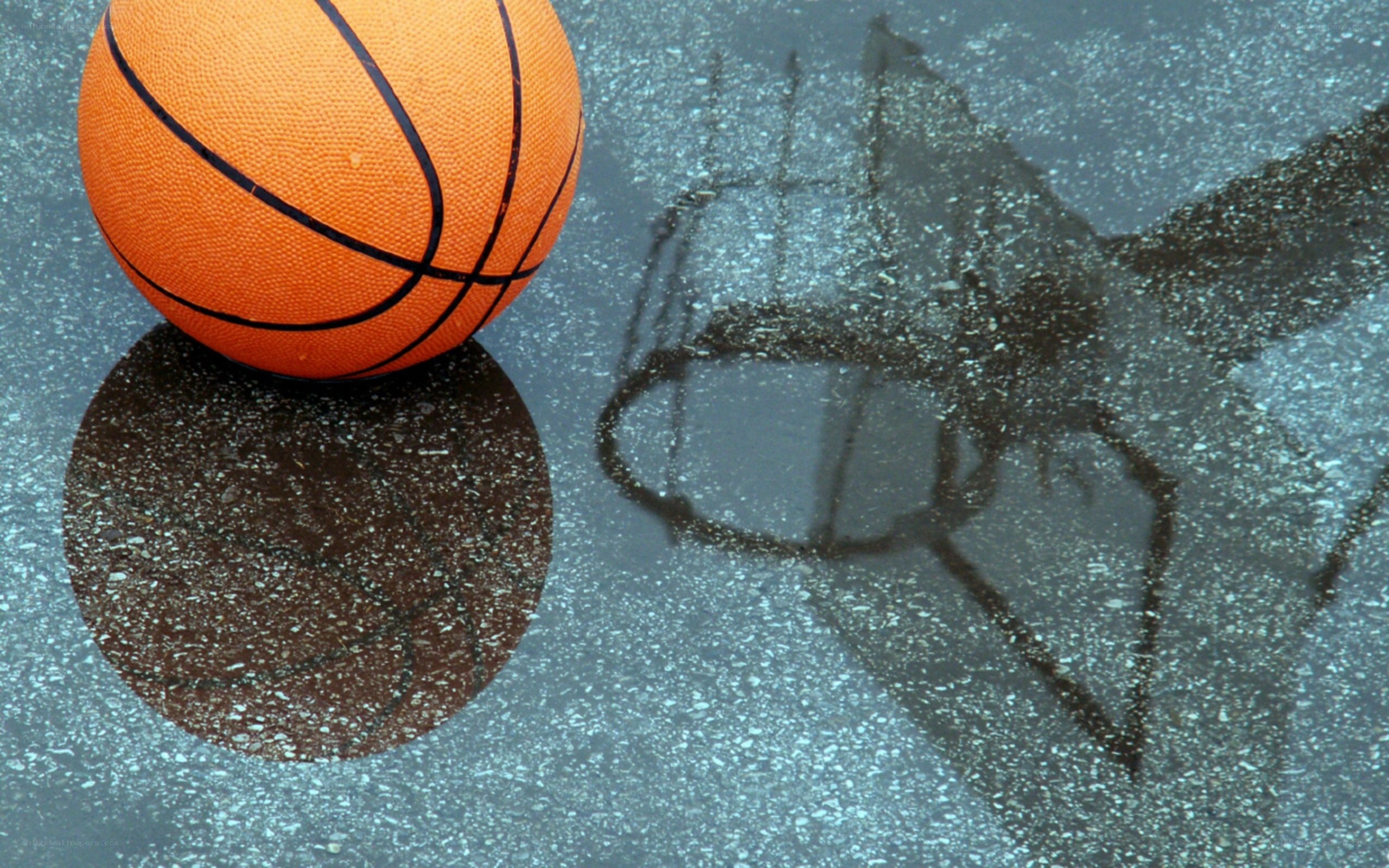 Basketball on wet pavement