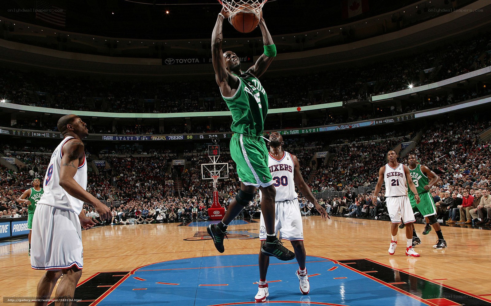 basketball player dunks ball