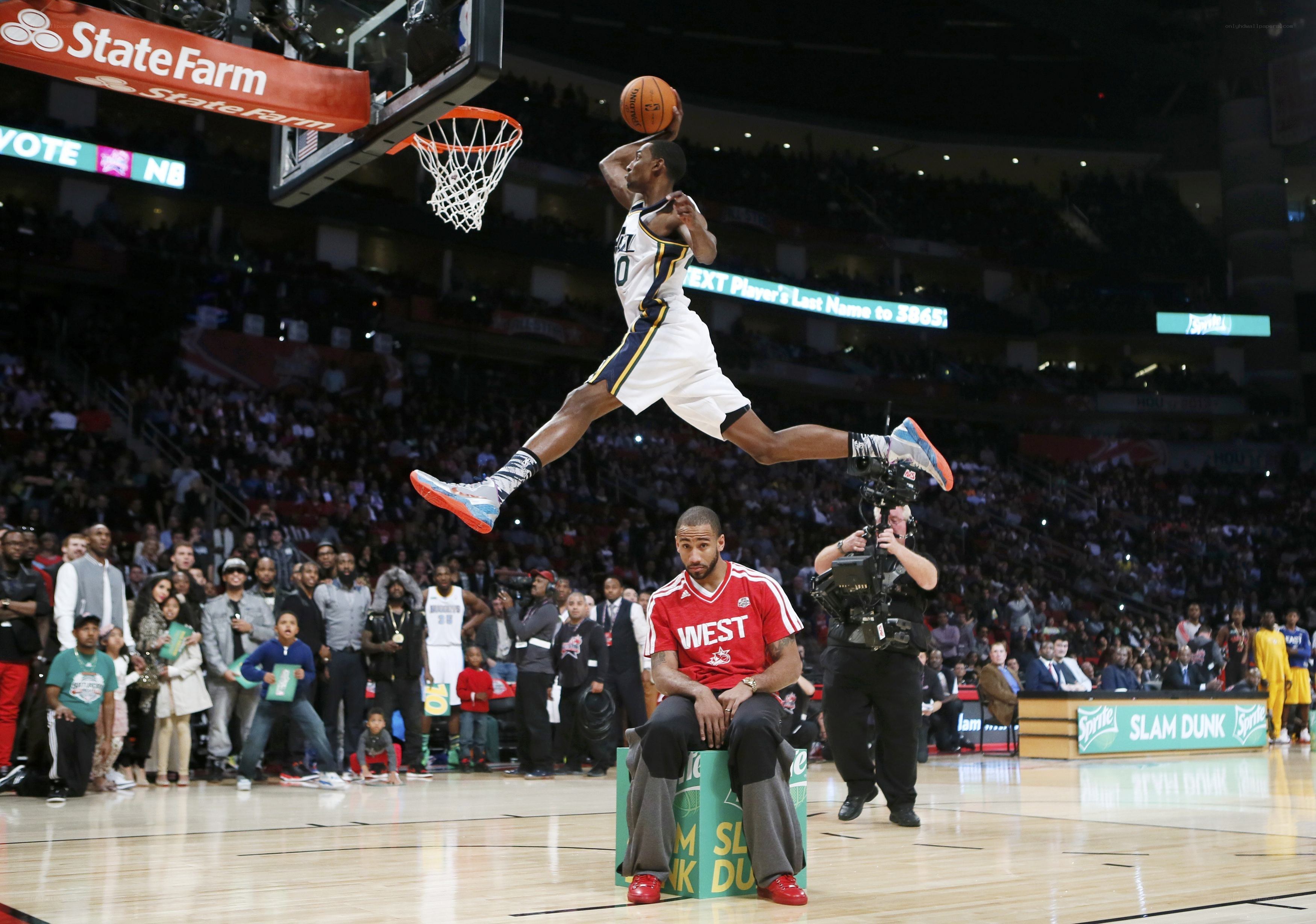 basketball player dunks ball