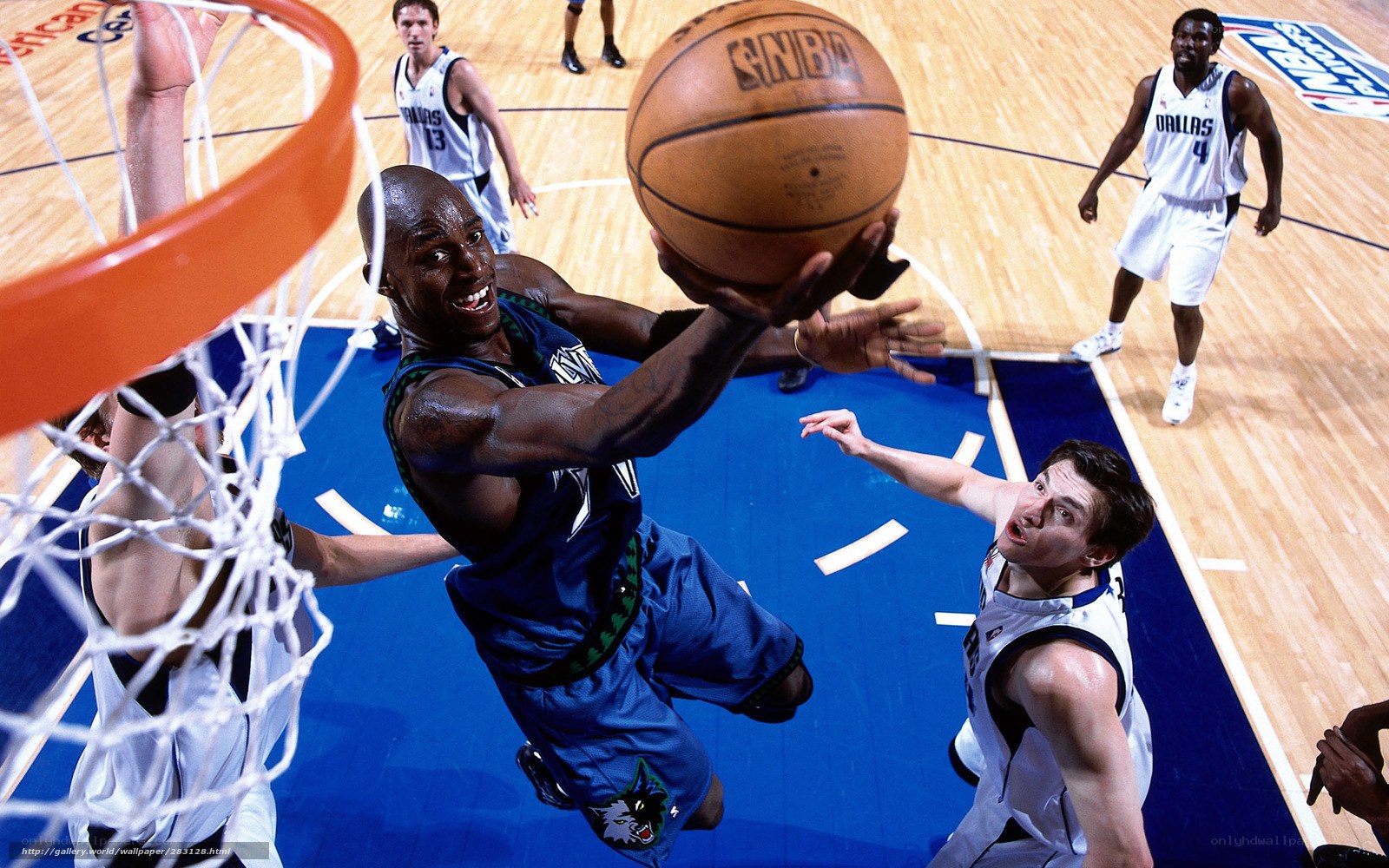 basketball player dunks ball