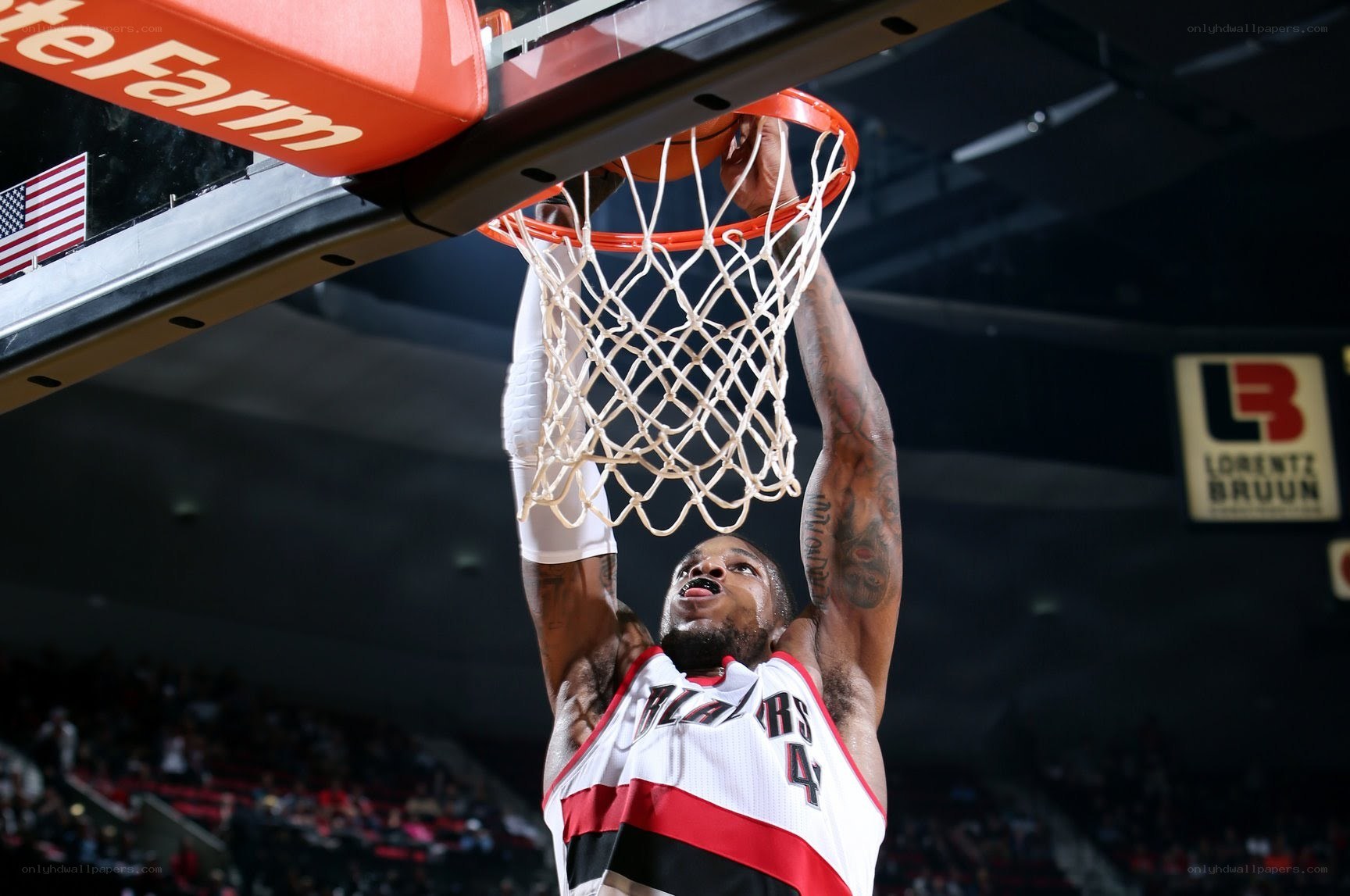 basketball player dunks the ball