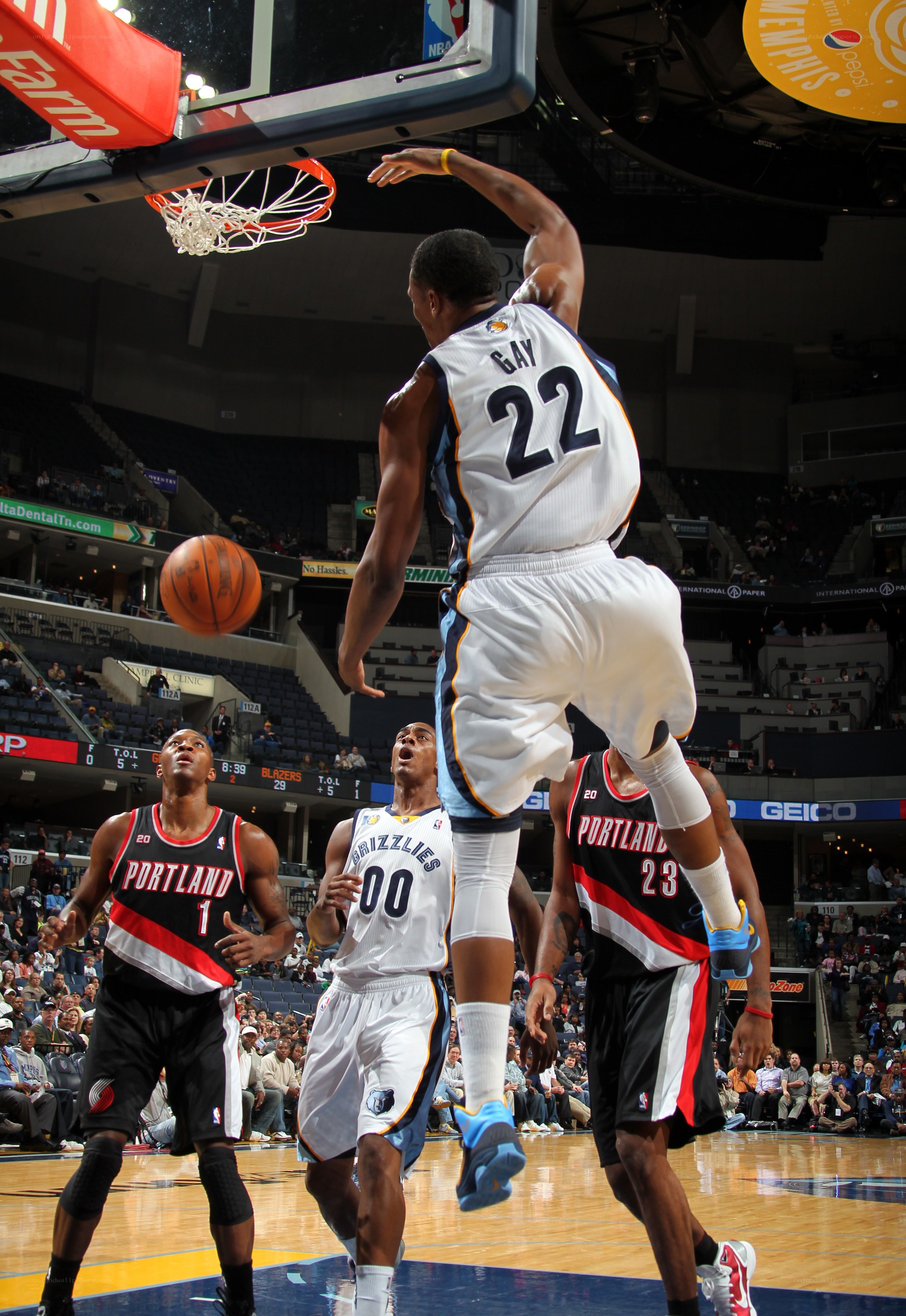 basketball player dunks the ball