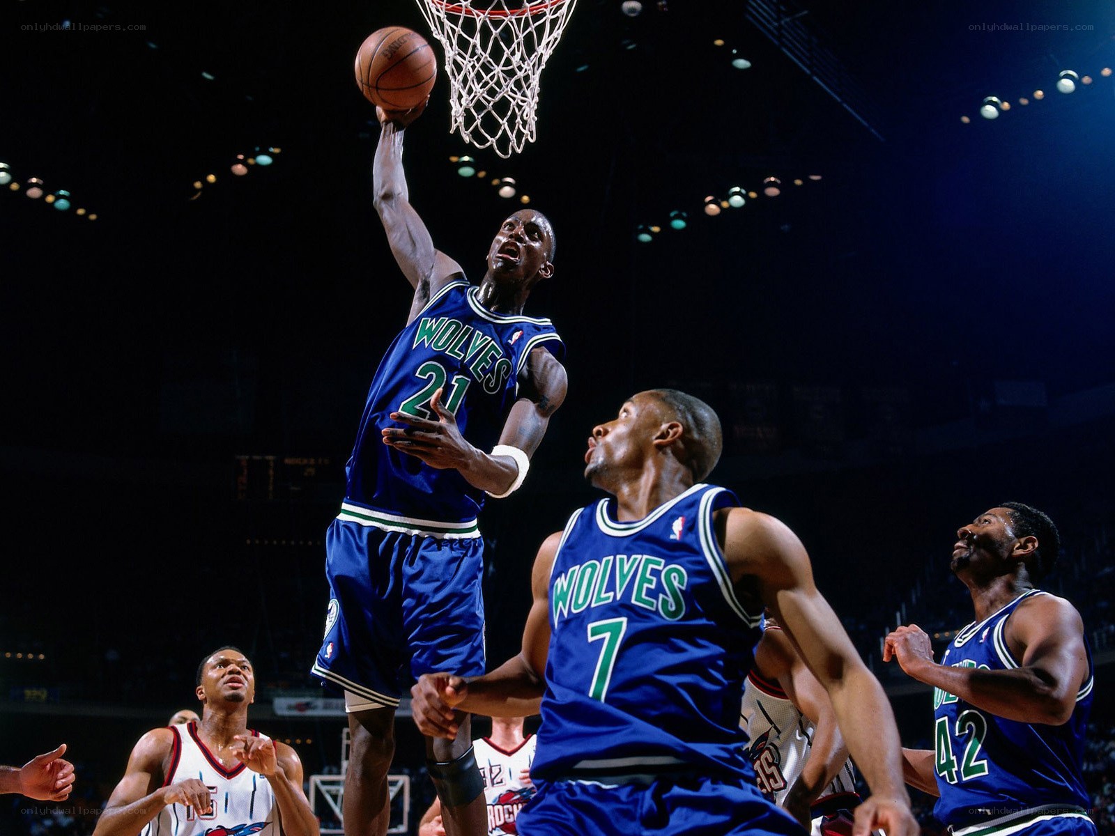 basketball player dunks the ball