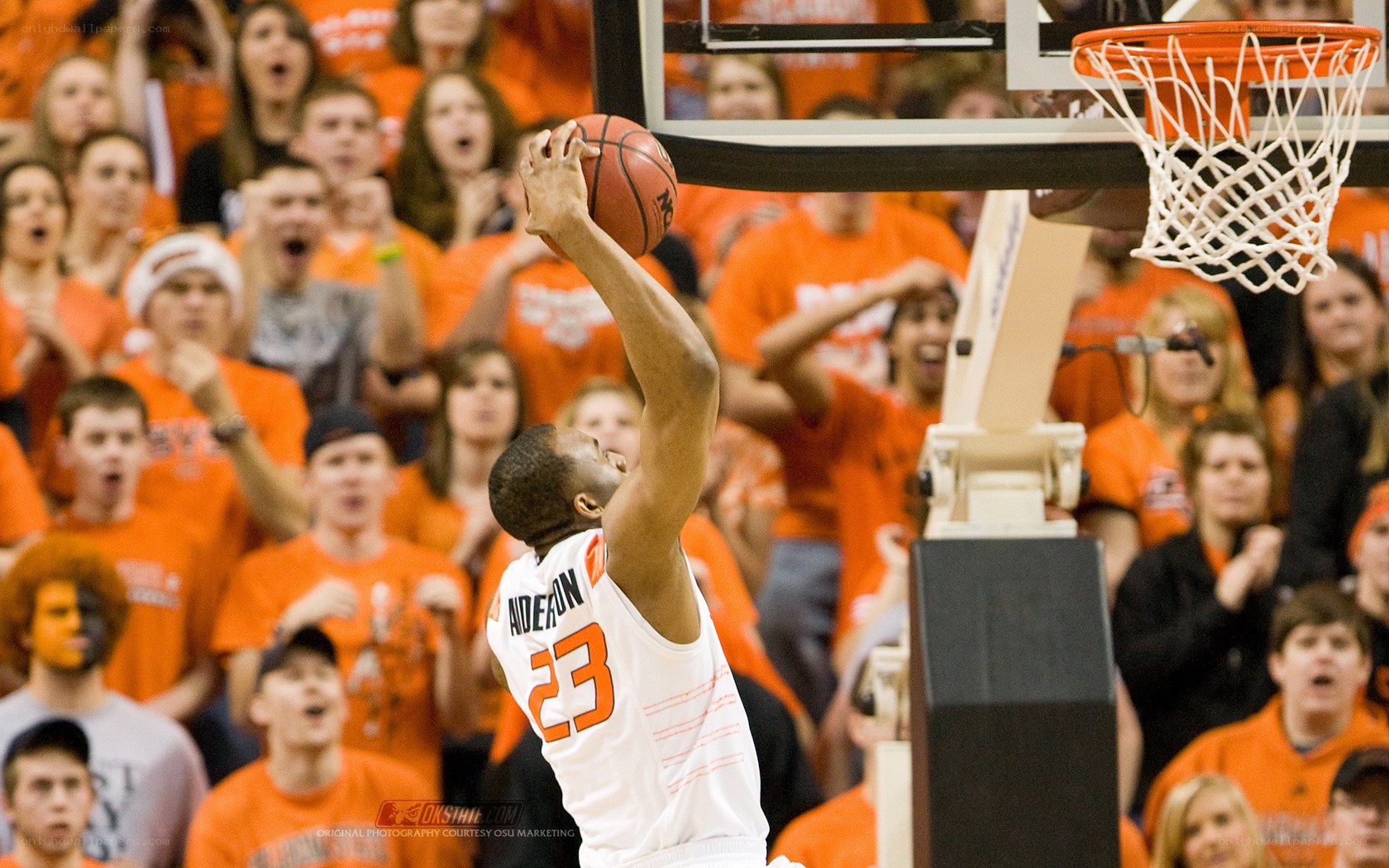 basketball player dunks the ball