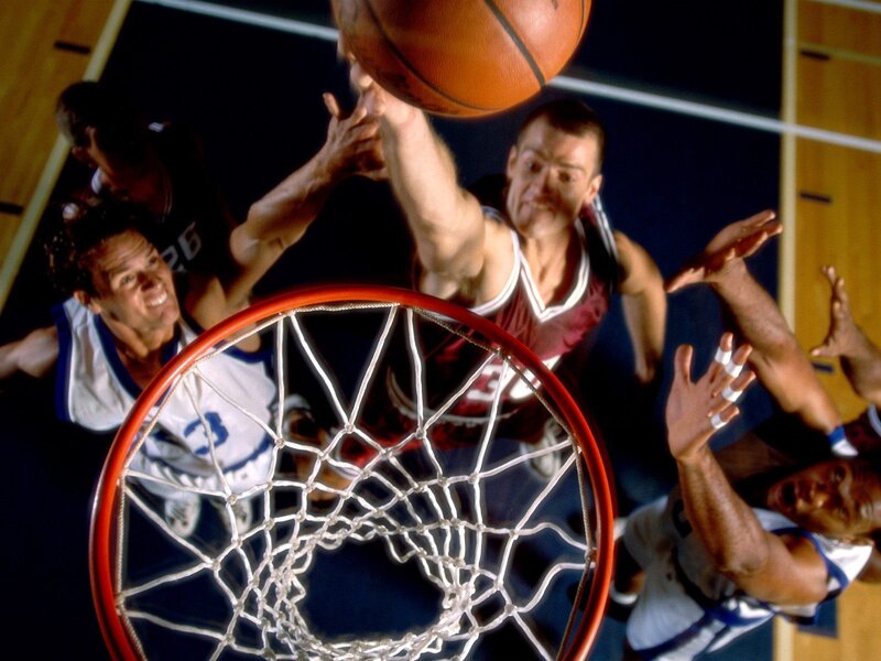 Basketball player shooting at hoop