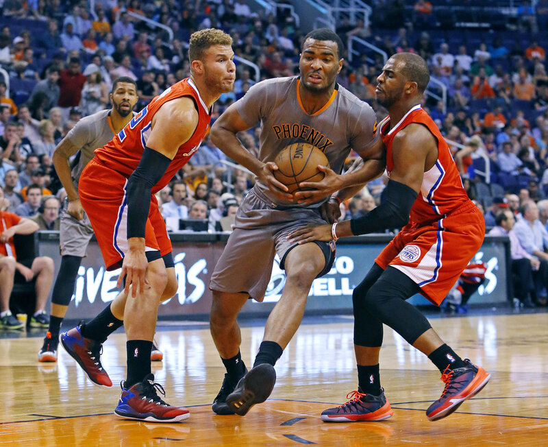 Basketball Players in Action — Orange