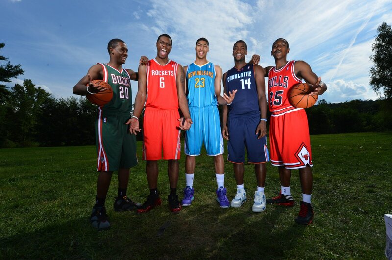 basketball players in team uniforms
