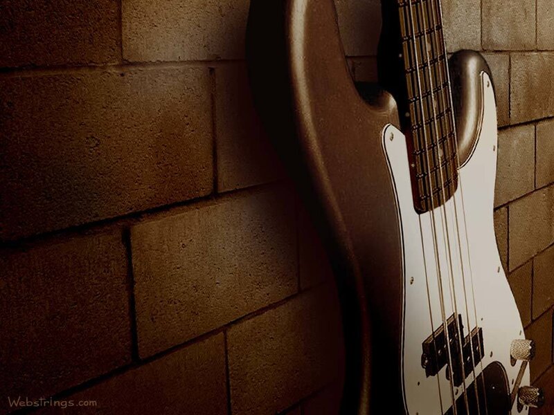 Bass guitar against brick wall