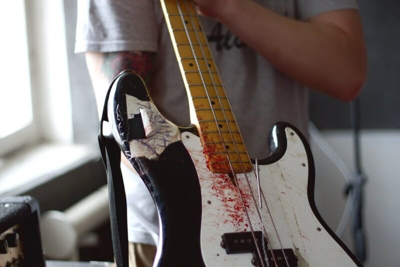 Bass guitar with blood-like stains