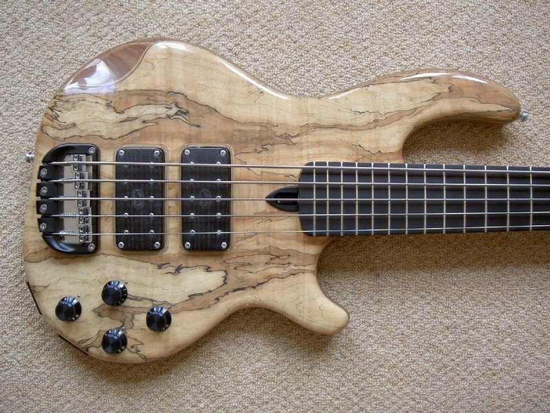 bass guitar with wood grain body