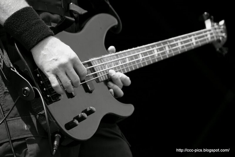 bass guitarist performing live