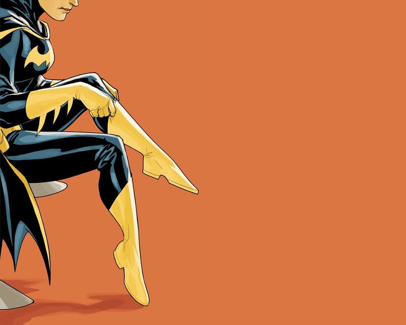 Batgirl sitting on a chair
