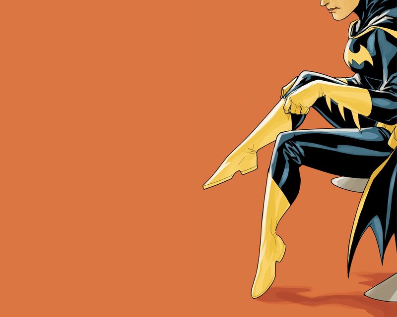Batgirl sitting on a chair