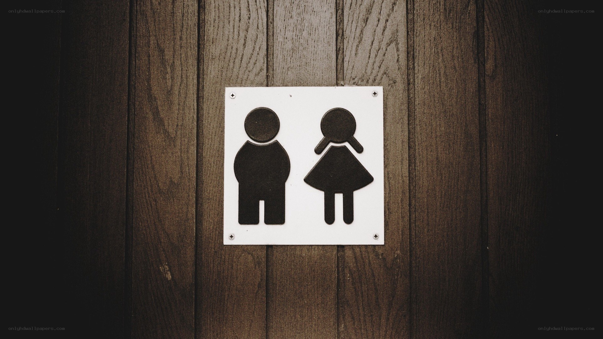 bathroom sign on wood wall