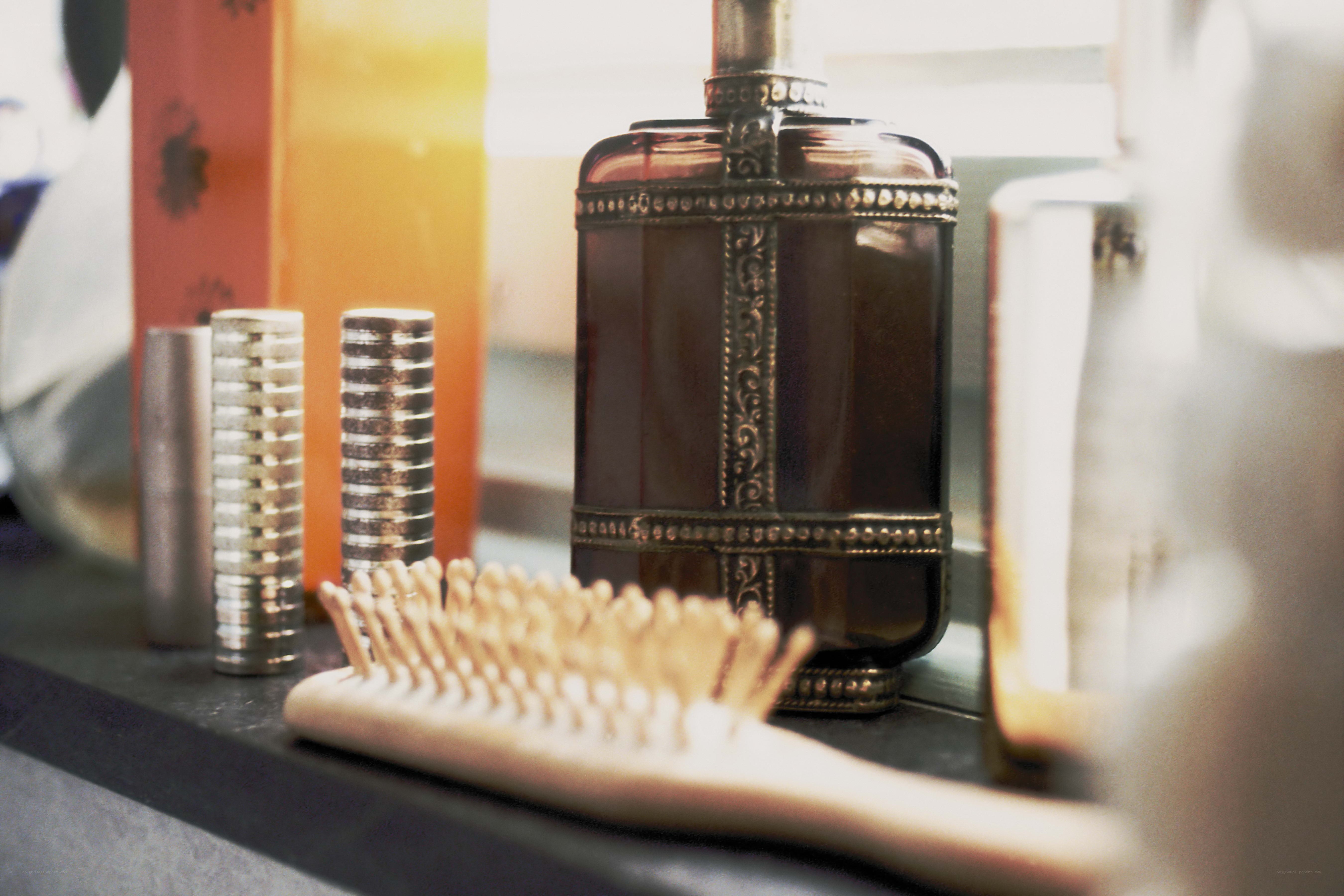Bathroom vanity with perfume and brush