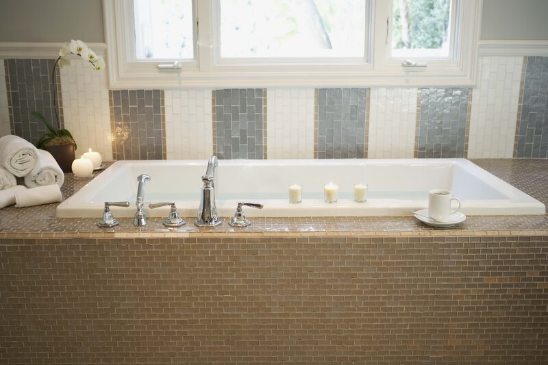 Bathroom with bathtub and candles