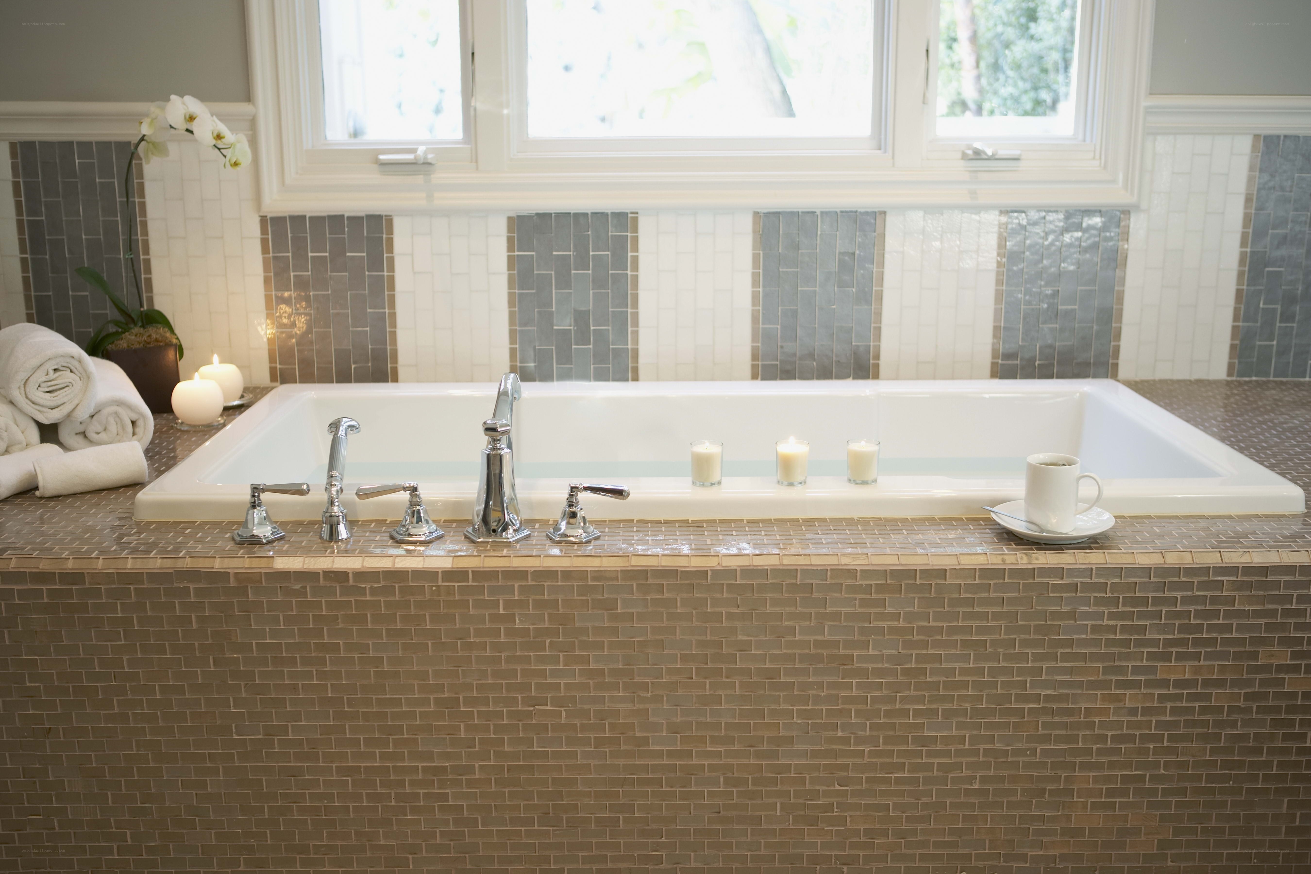 Bathroom with bathtub and candles