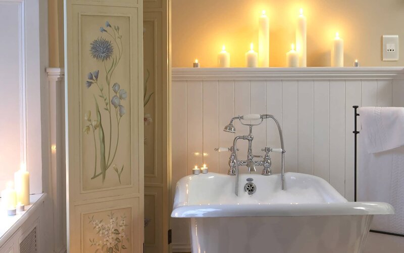 Bathroom with candles and bathtub