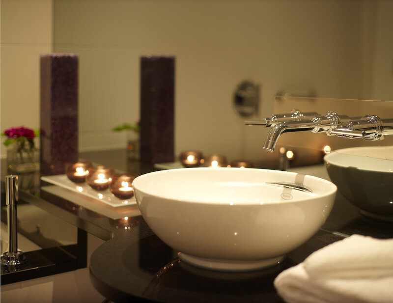 Bathroom with candles and bowl sink
