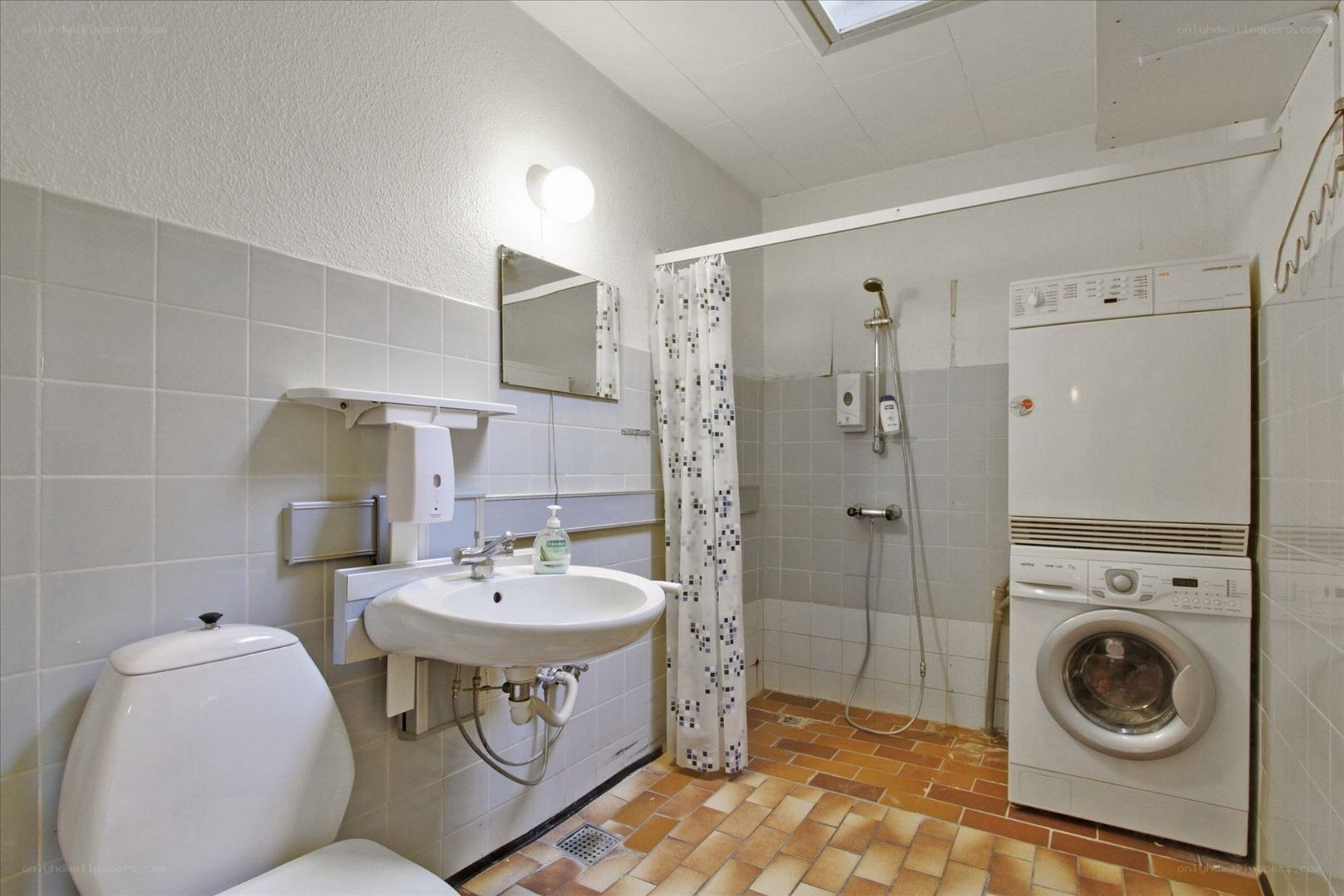 Bathroom with shower and washer