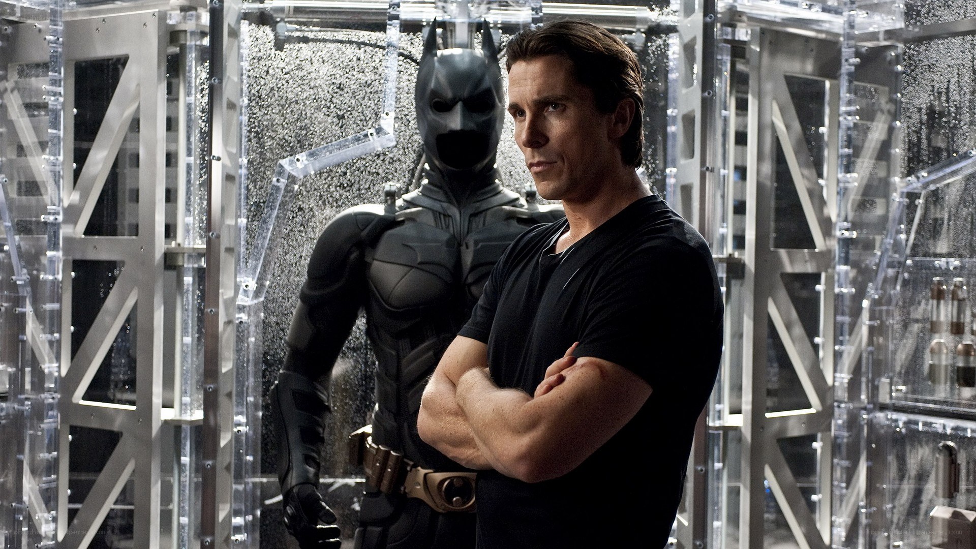 Batman and Bruce Wayne in Batcave