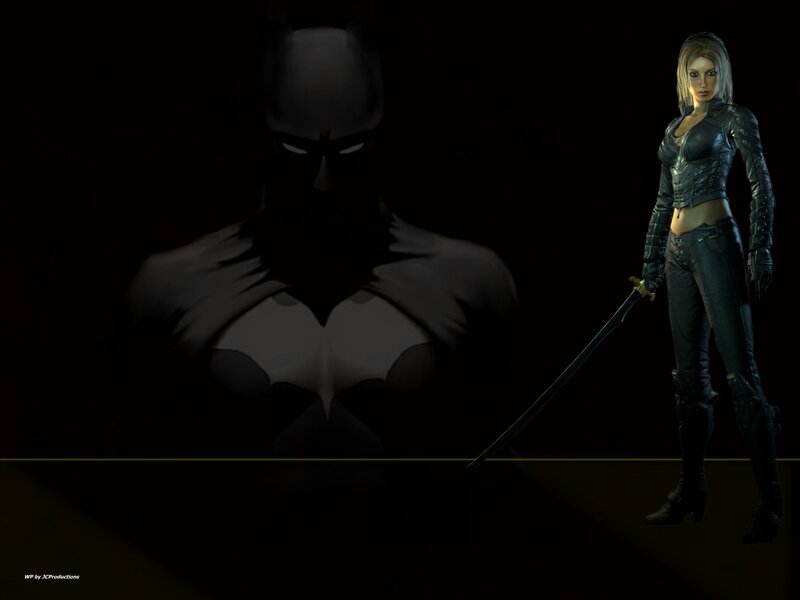 Batman and Catwoman in dark scene