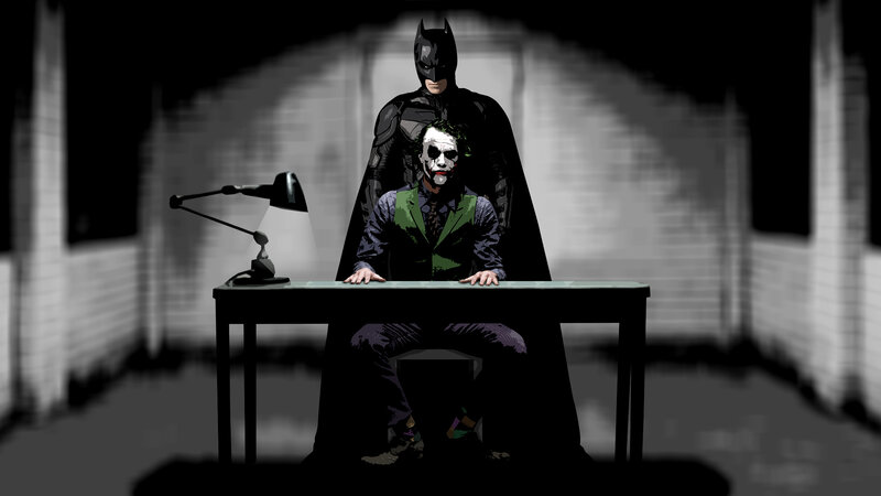 Batman and Joker at a desk
