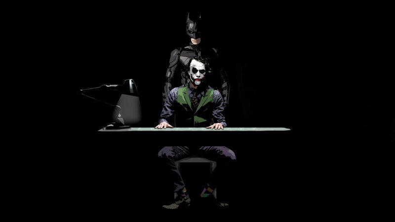 Batman and Joker at desk