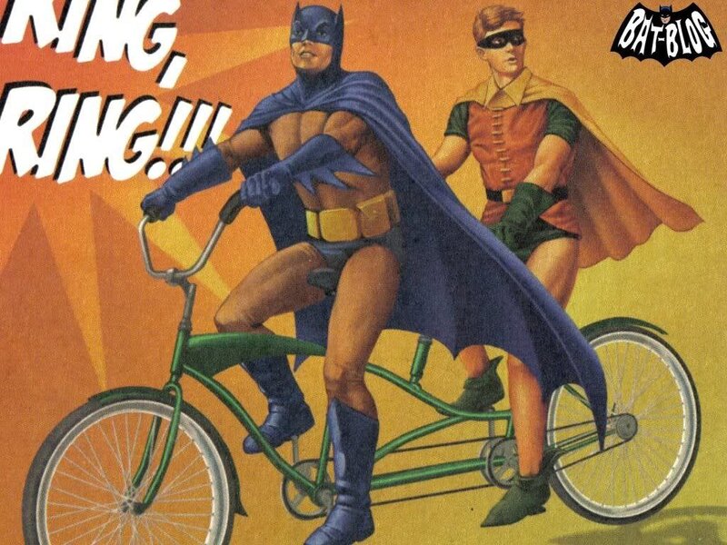 Batman and Robin on a tandem bike