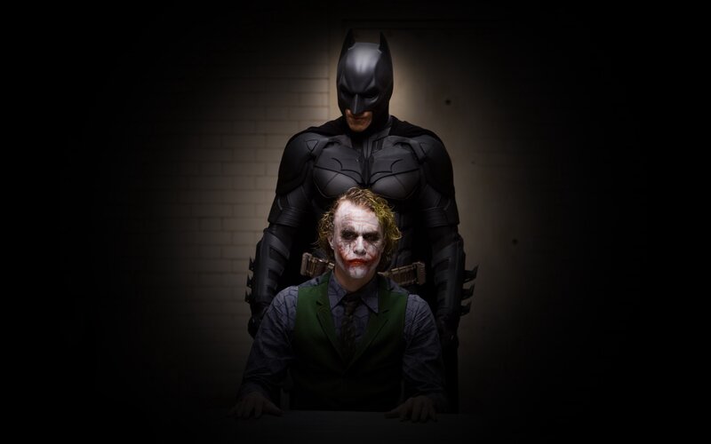 Batman and the Joker in a dark room