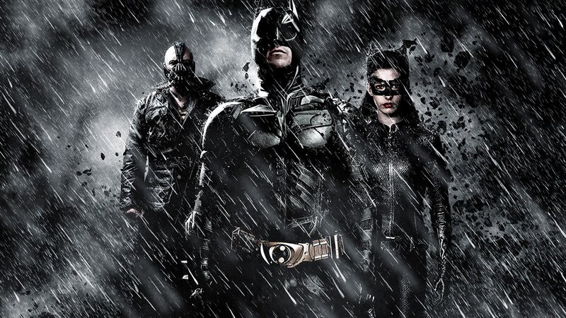 Batman, Bane, and Catwoman in rain