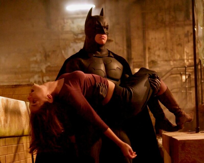 Batman Carrying a Woman