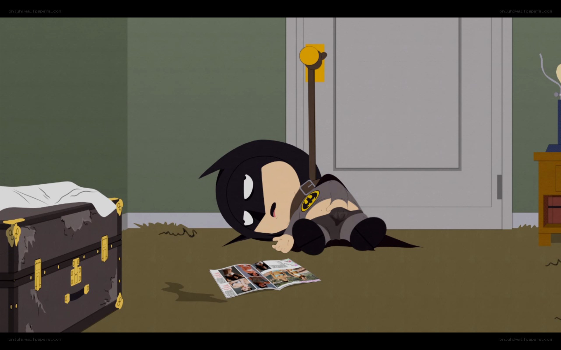 Batman child lying on floor