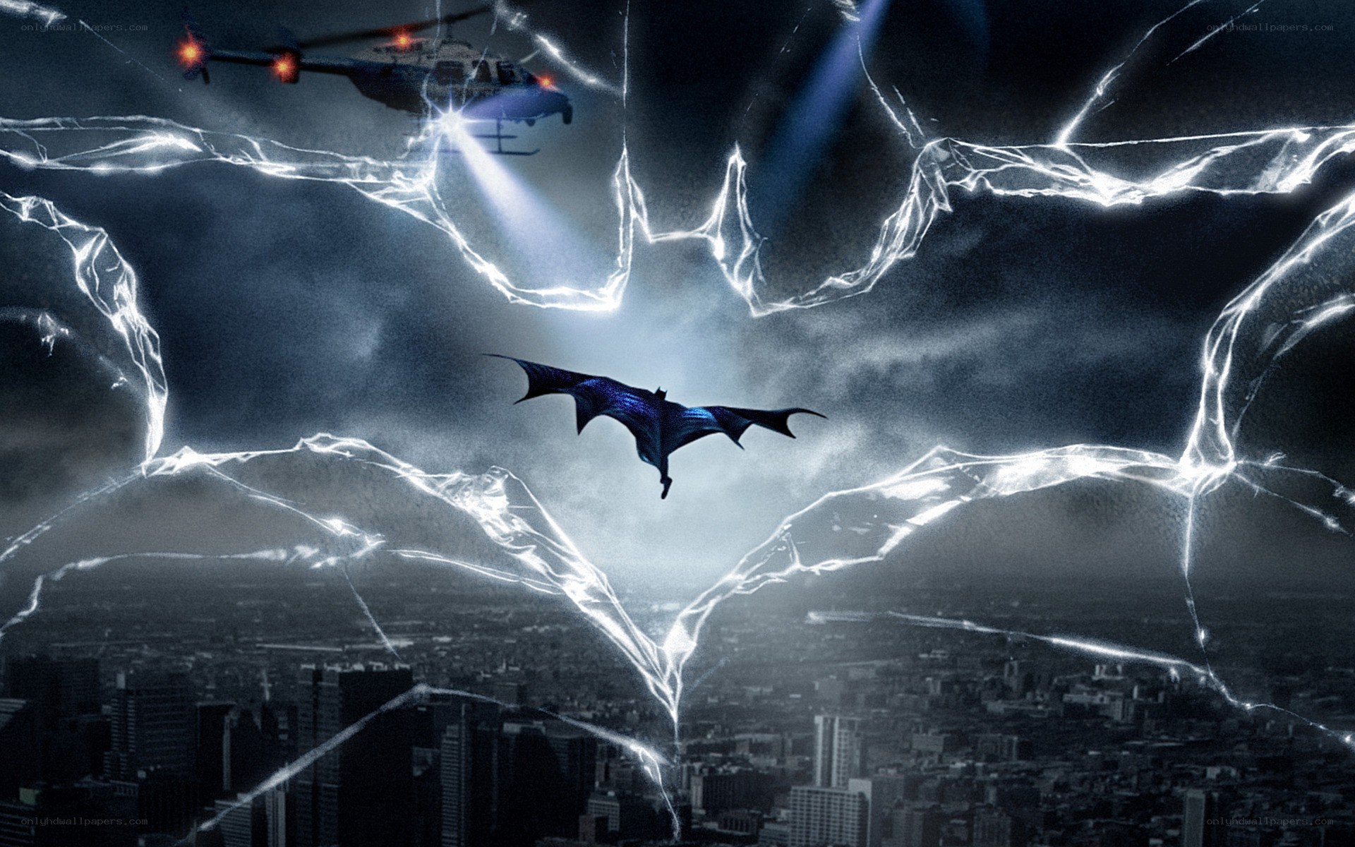 Batman flies over city at night