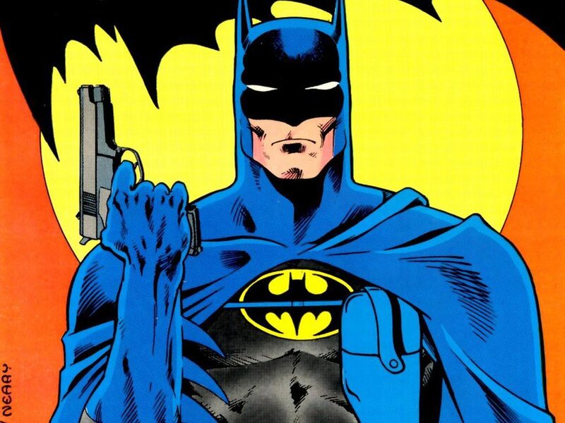 Batman holding a gun