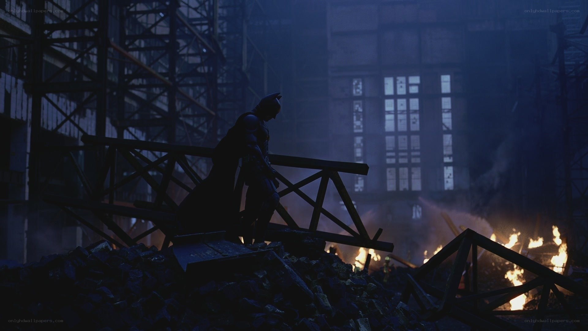Batman in a burning ruin