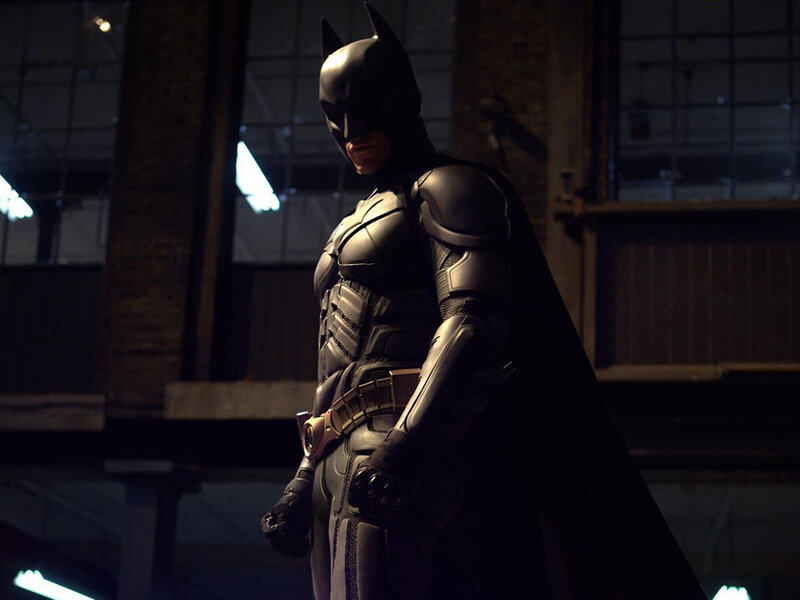 Batman in a dark warehouse